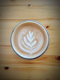 Close-up of cappuccino on table