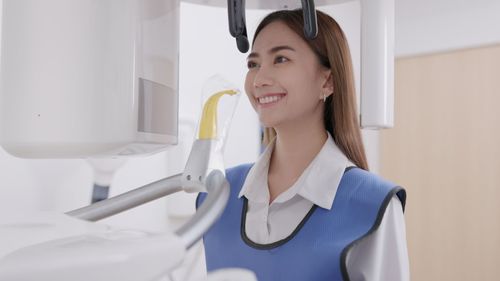 Portrait of woman standing in laboratory