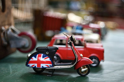 Red toy car on street