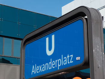 Information sign against blue sky