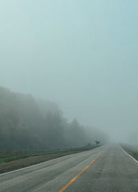 Empty road against clear sky