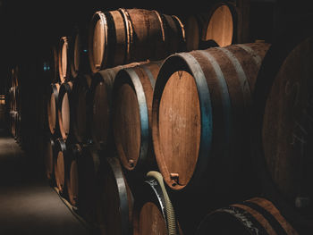 Stack of wooden barrels in row