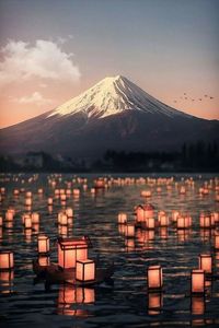 Scenic view of snowcapped mountains against sky during sunset