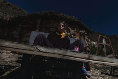 Man standing against sky at night