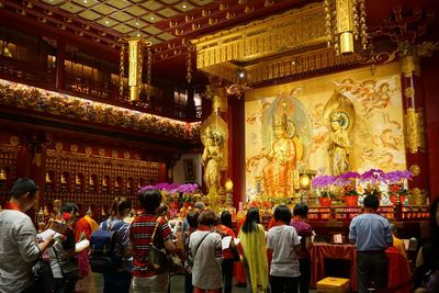 Group of people in temple outside building