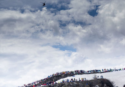 Low angle view of people against sky