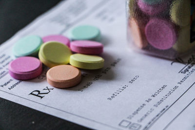 Close-up of colorful pills on prescription