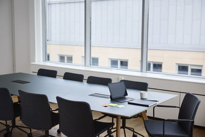 Digital tablet and diary on meeting table