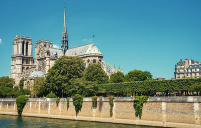 View of trees and buildings against sky