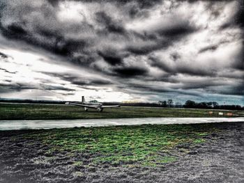 Scenic view of landscape against cloudy sky