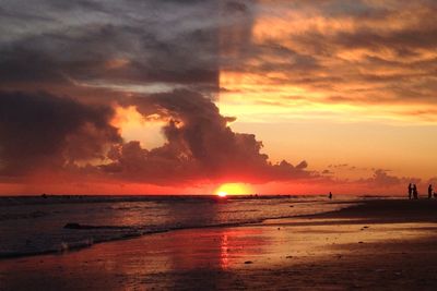 Scenic view of sea against cloudy sky