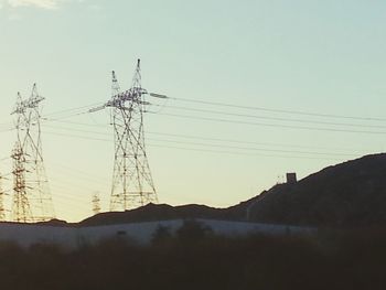 Low angle view of electricity pylon