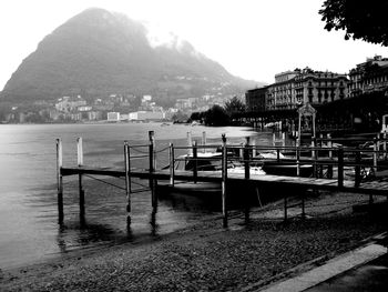 Calm sea with mountain range in background