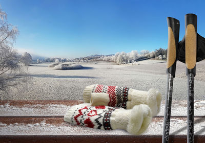 Snow on field against clear blue sky