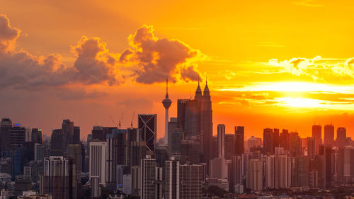 Cityscape against sky during sunset