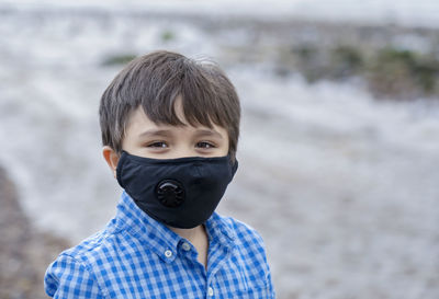 Portrait of boy on sea shore