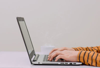 Man using laptop on table