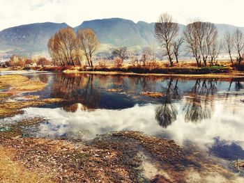 Scenic view of lake with mountains in background