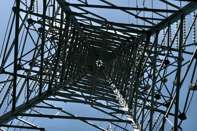 Low angle view of grid structure against sky