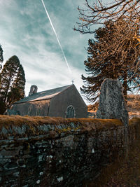 Low angle view of abandoned building against sky