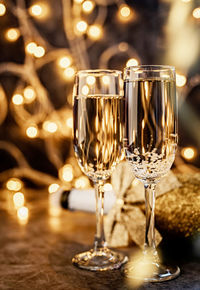 Close-up of wine glasses on table