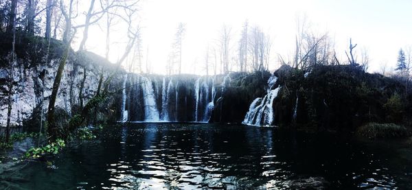 Scenic view of waterfall against clear sky