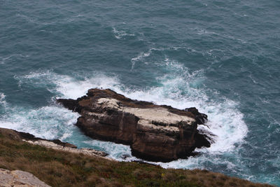 High angle view of rocks in sea