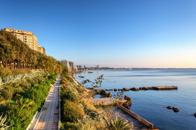 Scenic view of sea against clear blue sky