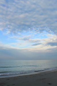 Scenic view of beach against sky during sunset