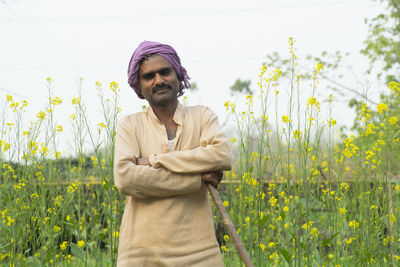 Portrait of farmer standing in field