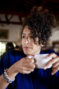 Relaxed woman drinking a cup of coffee,