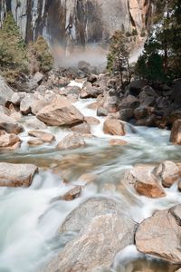 River flowing through rocks in forest