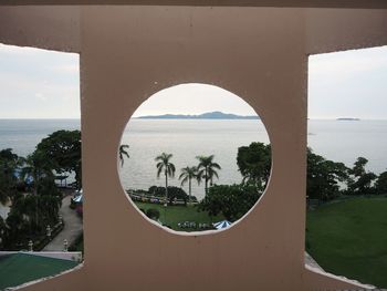 Scenic view of sea seen through window