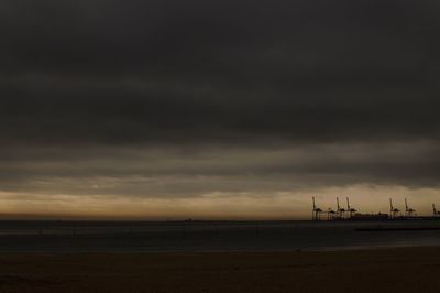 Scenic view of beach against sky during sunset