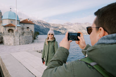 Side view of woman using mobile phone