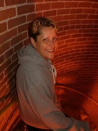 Portrait of smiling boy against wall