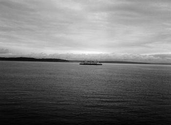 Scenic view of boats in sea against sky