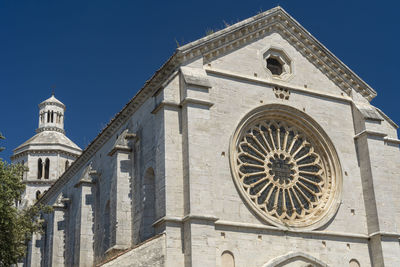 Low angle view of traditional building against blue sky