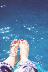 Low section of woman in swimming pool