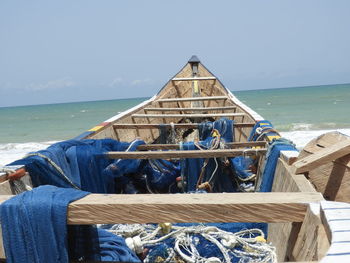 Scenic view of sea against clear sky with a fishingboat