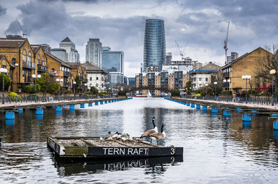 View of city buildings by river