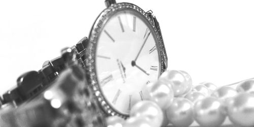 Close-up of clock against white background