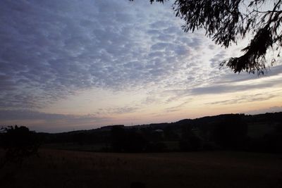 Scenic view of silhouette landscape against sky during sunset