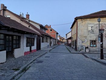 Footpath amidst buildings in town