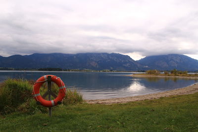 Scenic view of lake and mountains against sky