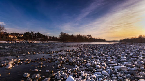 Scenic view of beach against sky during sunset