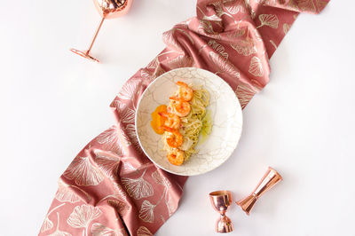 Cropped hand of woman holding food on table