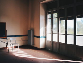 Sunlight falling through door on floor in room