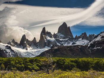 Scenic view of snowcapped mountains against sky