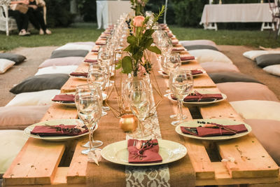 Food on table by potted plants